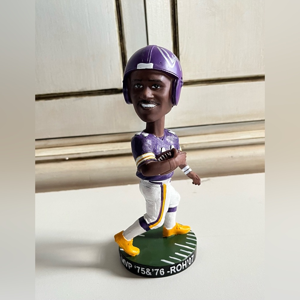 limited edition Chuck Foreman “Spin Doctor" Bobblehead of the Minnesota Vikings.